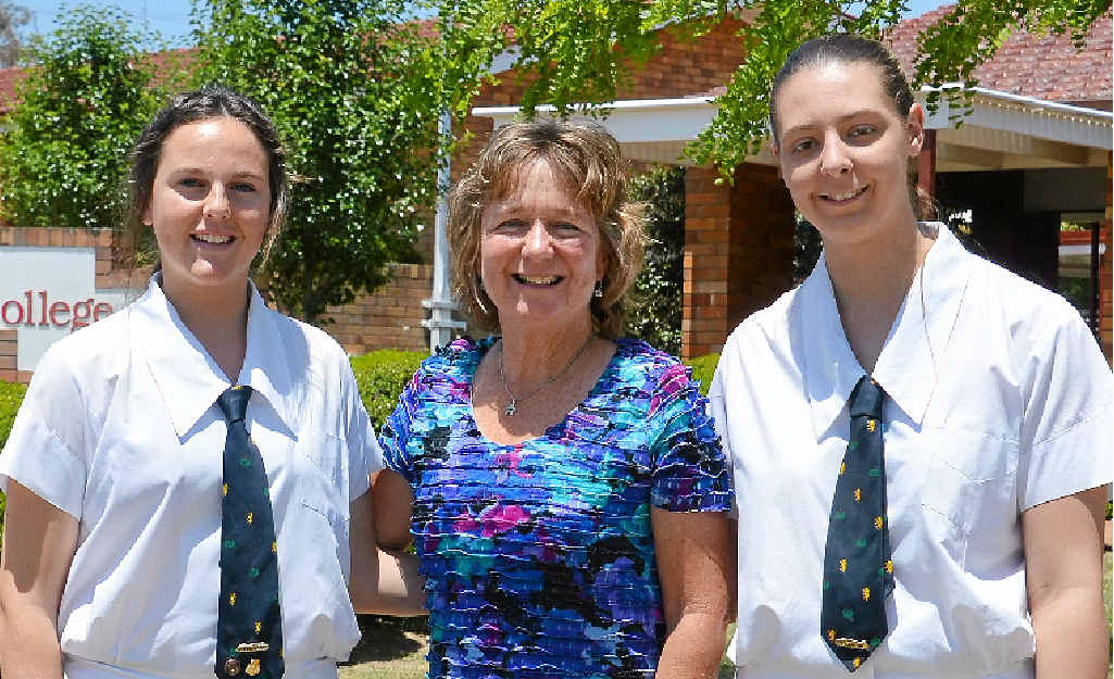 Mrs Noela Ensbey with OP 2 recipients 2014 Scots PGC College dux Rylie Douglas and Cassandra Burtenshaw.
